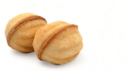 Two fresh and tasty cookies in the shape of a walnut with boiled condensed milk on a white background. A favorite delicacy for children and adults with a delicate filling inside.