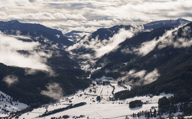 Belagua Valley. Clouds and mist ascend the snow-covered Belagua Valley, Navarra.