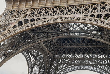 Architectural detail design of the famous Eiffel Tower iron structure. Close-up of the framework of the Eiffel Tower in Paris, France, Space for text, Selective focus.