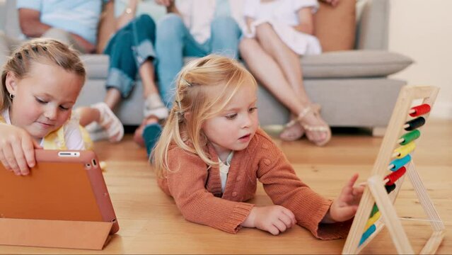 Children, girls and playing with games in living room of home for child development and creative fun with abacus. Family, kids and sisters with toys on floor for math, learning and tablet in lounge