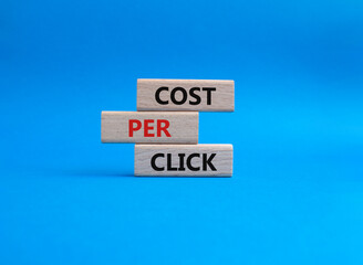 Cost Per Click symbol. Concept word Cost Per Click on wooden cubes. Beautiful blue background. Business and Cost Per Click concept. Copy space.