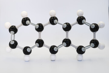 Anthracene molecule made by molecular model on white background. Chemical formula with colored atoms and bonds	