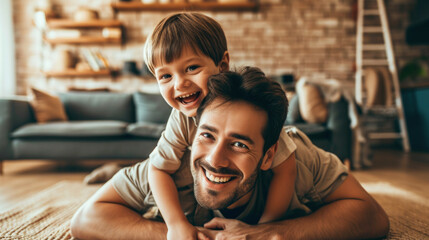 Happy loving daddy and cute boy playing active games at home. Family leisure concept - obrazy, fototapety, plakaty