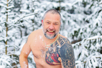 Winter tempering procedures. Naked man in the snow. Guy in snow showers for the hardening of the...