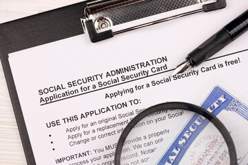 United States social security number cards lies on Application from social security administration...
