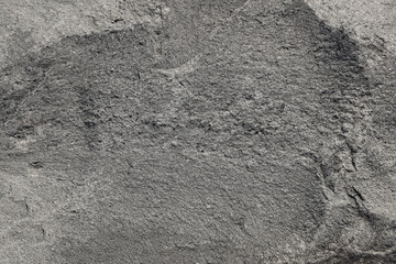 Black or dark gray rough grainy stone texture background. texture of the stone light gray. Stone texture in black tones. natural hard material.