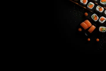 Fotobehang Cuisine du Japon, assortiment de sushis sur un fond noir, image avec espace pour texte © David Giraud