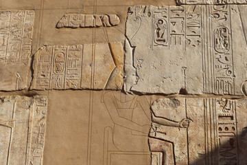 Ancient egyptian hieroglyphics carved on walls of Satet temple on Elephantine island in Aswan, Egypt