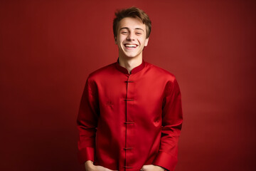 Fototapeta premium portrait of a man wearing red Chinese clothing to commemorate Chinese New Year with generative ai