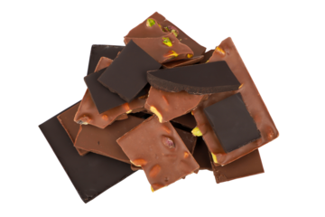 a pile of pistachio chocolate isolated on a transparent background. lots of pistachio chocolate stacked on top of each other. png isolated.