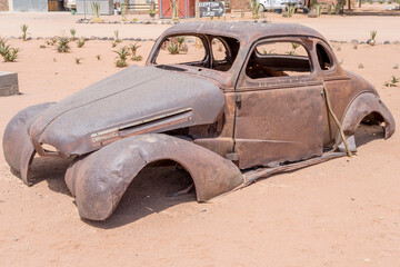 vintage 40's car-body worn down by rust in exibition at Betta, Namibia
