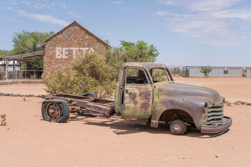vintage pick-up truck wreck worn down by rust in exibition at Betta, Namibia