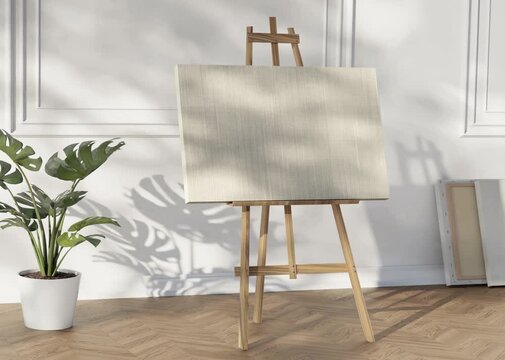 Easel with a white blank canvas video mockup near white wall panels