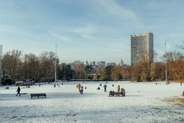 Wintertime in Schaerbeek, Brussels with snow and people having fun