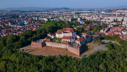 Landscape photography of the modern star shaped fortification in Brasov, Romania. Photography was taken from a drone at a higher altitude with camera level for a panoramic still of the bastion.