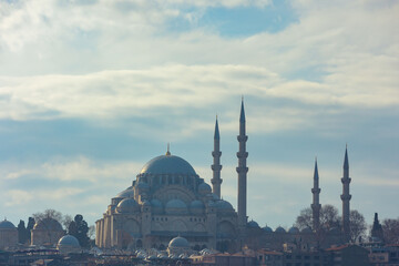 Suleymaniye Mosque view with cloudy sky and haze.