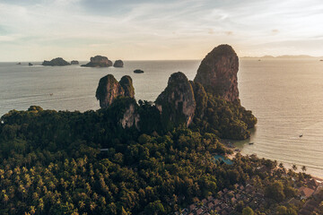 Aerial view of Railay beach rock formations, Krabi, Thailand in wet season during sunset