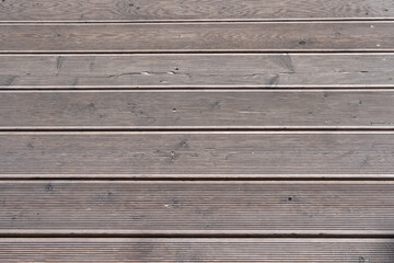 Dark wooden texture. Rustic three-dimensional wood texture. Modern wooden facing background. Wood background