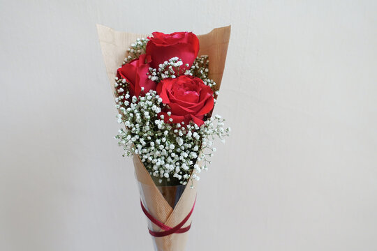 Three red rose mix with baby breath bouquet