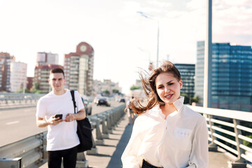 Fototapeta premium Happy couple walking along bridge
