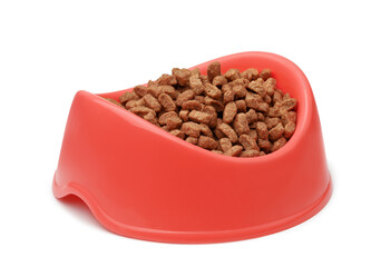 Dry pet feed in red plastic bowl
