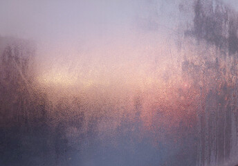 Frosty sunrise behind the glass