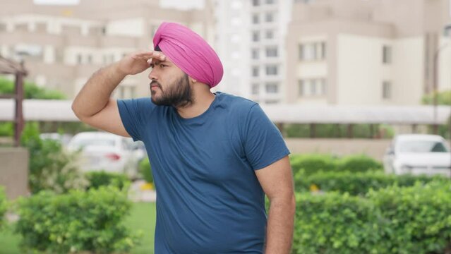 Sikh Indian Man Looking For Someone With Hand On Forehead