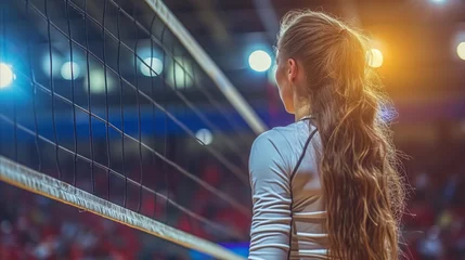 Fotobehang Female volleyball player waiting to serve at an indoor court © OKAN
