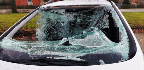 Damaged wrecked car after serious car crash in traffic