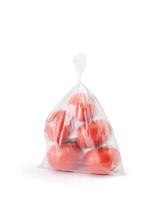 Tomatoes in a closed transparent plastic bag on a white background. Vertical photo.