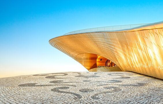 Belem, Lisbon, Portugal - MAAT Museum building at sunset - Typical Portuguese Pavement.