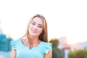 Outdoors portrait of beautiful young blond woman