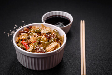 Delicious Asian dish udon with hot peppers, green beans, spices and herbs