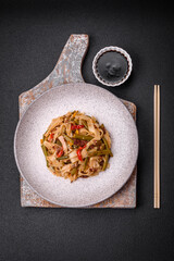 Delicious Asian dish udon with hot peppers, green beans, spices and herbs