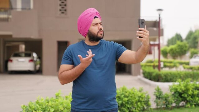 Serious Sikh Indian Man Talking on Video Call