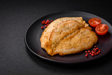 Delicious battered chicken breast chops with salt, spices and herbs
