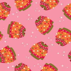 Cute vibrant hand drawn sweater with winter decoration and pom-poms seamless pattern. Colorful holiday vector illustration on pink background. Vibrant repeat design.