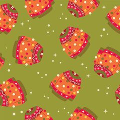 Cute vibrant hand drawn sweater with winter decoration and pom-poms seamless pattern. Colorful holiday vector illustration on green background. Vibrant repeat design.