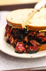 Sandwich with pastrami and mustard 