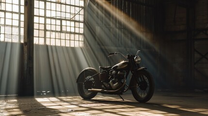 Vintage motorcycle standing in a dark building in the rays of sunlight