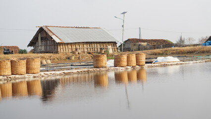 The process of making salt, in a salt evaporation pond in Jepara, Central Java, Indonesia