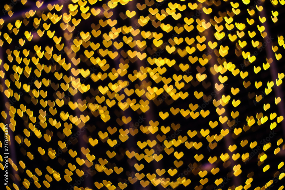 Poster yellow neon blur heart shape light from camera lens for pattern and background.
