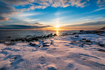The coast of the Gulf of Finland in winter at sunset