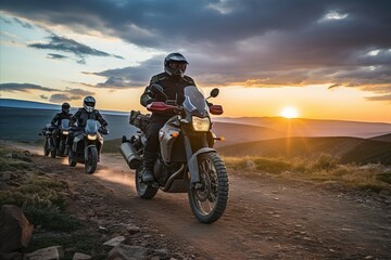Sunset mountain biking. adventurous cross country riders conquer majestic landscape