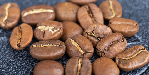 background of fresh roasted coffee beans, top view