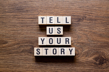 Tell us your story - word concept on building blocks, text