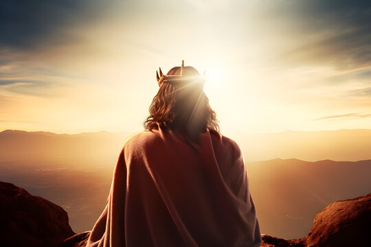 Back view of Jesus Christ with crown of throne looking and praying to god with a sunrise sky background. Good Friday and Easter day concept.