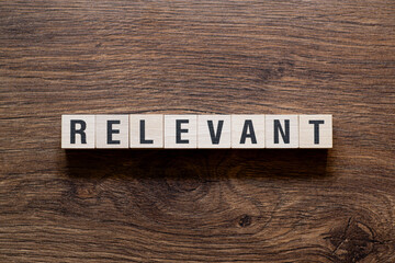 Relevant - word concept on building blocks, text