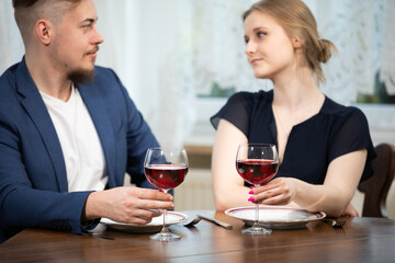 A family meeting over dinner and a glass of wine.