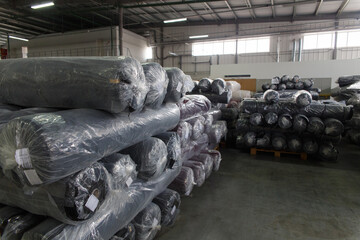 Rolls of black fabric and textiles